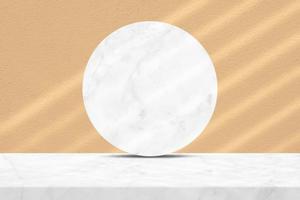 White Marble Table and Circle Marble Partition with Light and Beam on Brave Ground Brown Concrete Wall Texture Background, Suitable for Cosmetic Product Presentation Backdrop, Display, and Mock up. photo