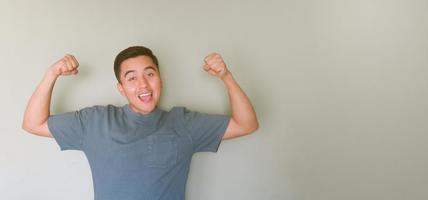 Happy normal complexion man showing his strength with happiness photo