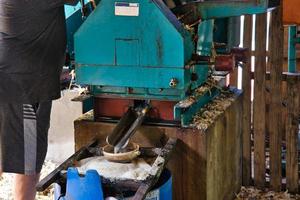 Sugarcane machine at takamaka rum distillery photo