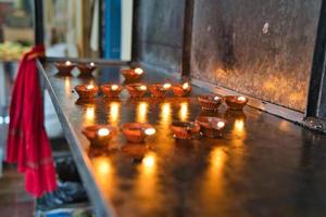 Candles inside the Hindu temple in town Victoria photo