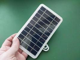 Solar battery to charge smartphone and power bank photo