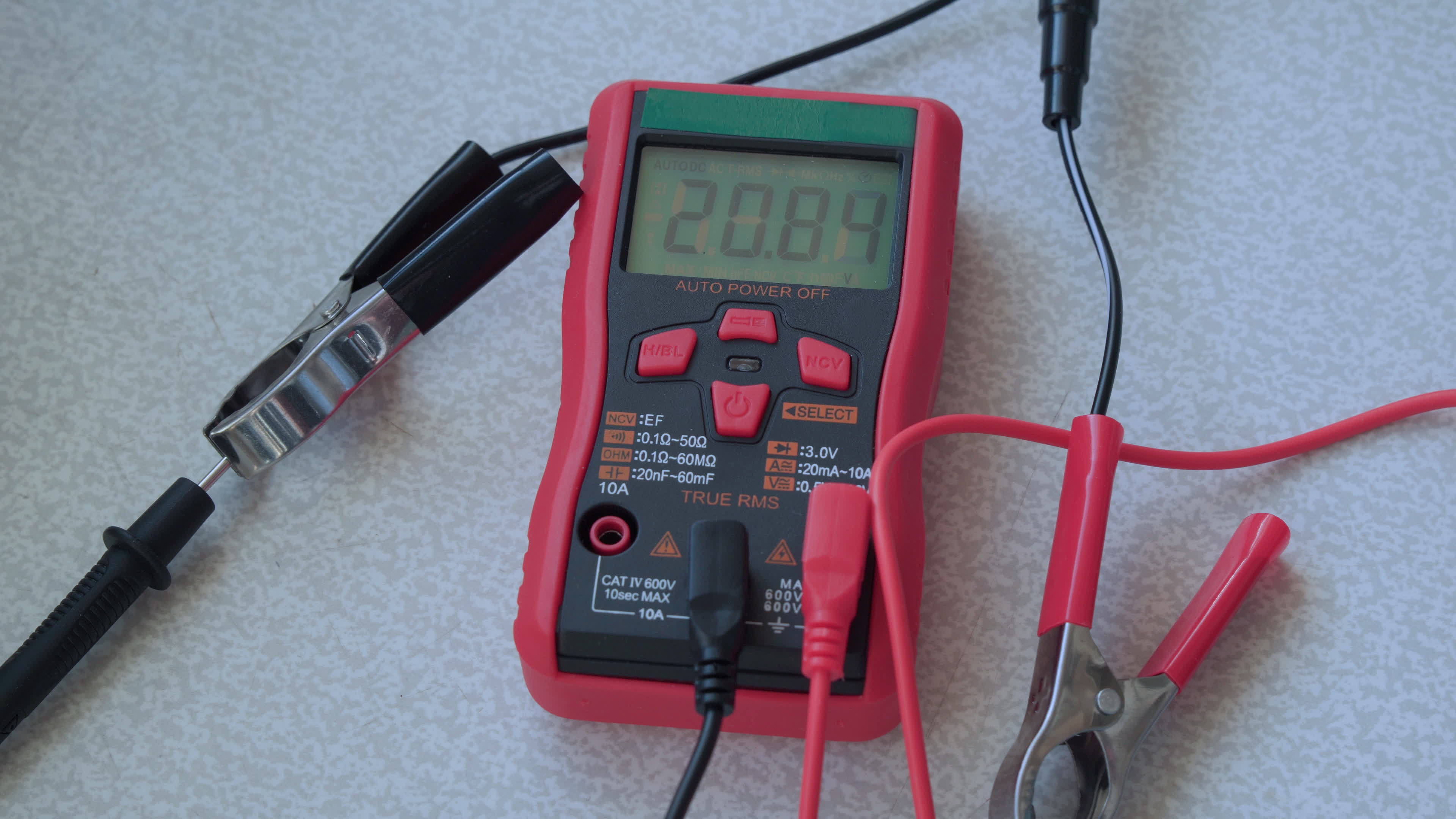Electronic tester with changing voltage readings on a digital screen