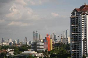 buildings in the city of jakarta at noon photo
