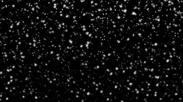 Snowfall bokeh on black background. Many snowflakes in flying in the air. Winte night snowfall and blizzard of snow at. Blur bokeh light effect creative background. photo