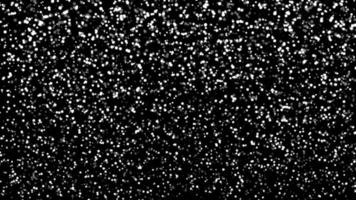 Snowfall bokeh on black background. Many snowflakes in flying in the air. Winte night snowfall and blizzard of snow at. Blur bokeh light effect creative background photo