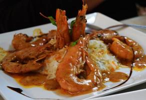 Shrimps with rice served on a plate photo