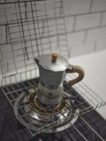 Italian caffettiera coffee pot on stove photo