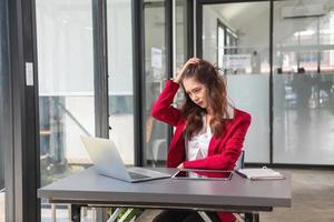 Concept Burnout Syndrome. Business Woman feels uncomfortable working. Which is caused by stress, accumulated from unsuccessful work And less resting body. Consult a specialist psychiatrist. photo