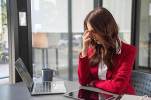 Concept Burnout Syndrome. Business Woman feels uncomfortable working. Which is caused by stress, accumulated from unsuccessful work And less resting body. Consult a specialist psychiatrist. photo