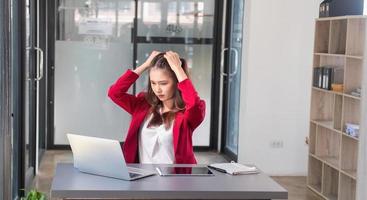 Concept Burnout Syndrome. Business Woman feels uncomfortable working. Which is caused by stress, accumulated from unsuccessful work And less resting body. Consult a specialist psychiatrist. photo