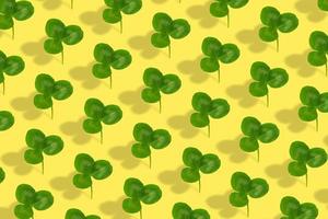 Clover leaf pattern on colored background. Abstract background for St. Patrick's Day photo