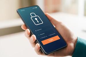 Cybersecurity internet and networking concept. hand holding smartphone information security and encryption, secure access to user's personal information, secure Internet access. photo