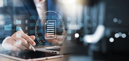 Document management system concept, businessman modern computer document management DMS, folder and document icon software, for efficient archiving and company data. photo