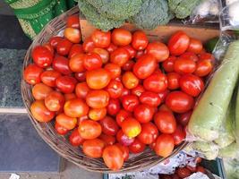 Fresh tomatoes in a basket photo