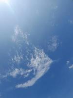 Beautiful white clouds on deep blue sky background. Large bright soft fluffy clouds are cover the entire blue sky. unique clouds photo