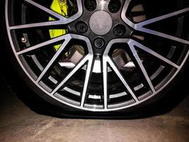 Car wheels with flat tires waiting to be repaired, checked photo