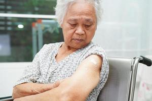 Asian elder senior woman getting vaccine for protect corona virus. photo