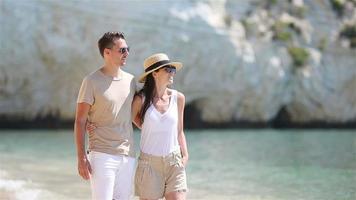 Young couple on white beach at summer vacation video