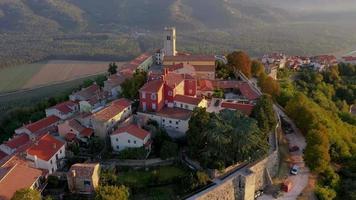 Drone video of historical Croatian town Motovun shot in the morning during sunrise