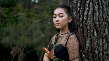 Archery women being panic in the jungle because they heard an enemy sound video