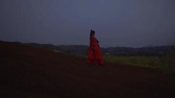 A Chinese Woman practicing a kung fu movement while standing on the mountain video