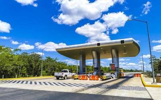 Playa del Carmen Quintana Roo Mexico 2022 Driving on highway freeway motorway thru toll booth house Mexico. photo