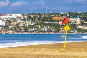 Puerto Escondido Oaxaca Mexico 2022 Red flag swimming prohibited high waves in Puerto Escondido Mexico. photo