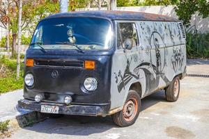 Playa del Carmen Quintana Roo Mexico 2021 Old black broken dirty VW bus Volkswagen car rusting Mexico. photo