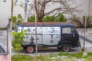 Playa del Carmen Quintana Roo Mexico 2021 Old black broken dirty VW bus Volkswagen car rusting Mexico. photo