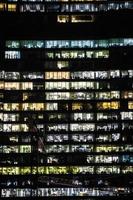 background with of offices in skyscraper in night photo