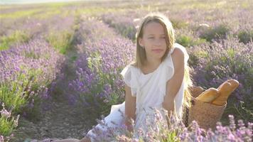 Girl in lavender flowers field in white dress video