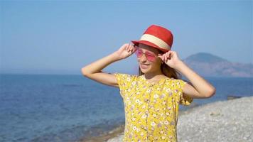 Cute little girl at beach during summer vacation video