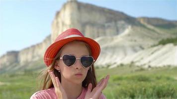 Kid on vacation on white rock background video