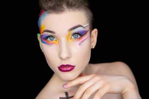 Young attractive brunette with creative make up photo