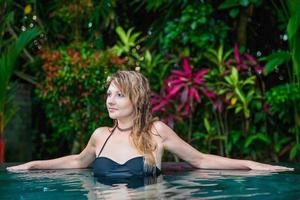 Charming young woman dressed in swimsuit photo