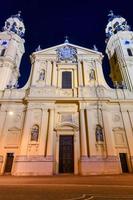 Munich, Germany - Jul 19, 2021, Front view of Theatinerkirche  Theatine Church of St. Cajetan  at night. Catholic church, inaugurated 1675. Baroque architecture. One of Munich's most famous churches. photo