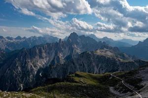 Beautiful sunny day in Dolomites mountains. View on Tre Cime di Lavaredo - three famous mountain peaks that resemble chimneys. photo