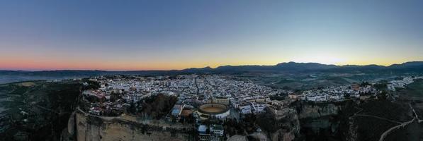Bullring of the Royal Cavalry of Ronda aerial view at sunrise in Spain. photo