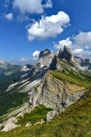 Morning view of the Gardena valley in Dolomite mountains. Location Puez-Geisler National Park, Seceda peak, Italy, Europe. Odle group is the landmark of Val di Funes. photo