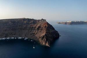 View of the cliffs of Thirasia in the caldera of Santorini, Cyclades islands, Greece, Europe photo