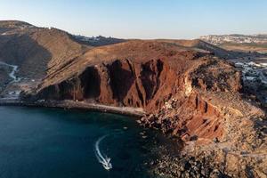 Red beach in Santorini, Cycladic Islands, Greece in the South Aegean. Beautiful summer landscape with one of the most famous beaches in the world. photo