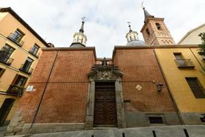 Baroque facade of the Saint Nicholas church Iglesia de San Nicolas  in Madrid, Spain photo