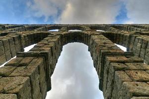 Ancient Roman aqueduct on Plaza del Azoguejo square in Segovia, Spain. photo