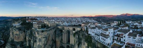 Rocky landscape of Ronda city with Puente Nuevo Bridge and buildings, Andalusia, Spain photo