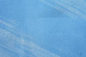 Sun Light Beam on Surface of Blue Concrete Wall Background. photo