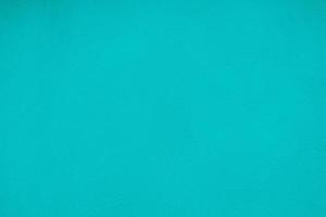 Dark Turquoise Color Concrete Wall with Wave Plaster Texture Background. photo