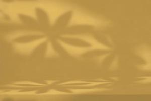 Concrete Table with Flower Leaves on Wall in Fortuna Gold Tone Background. photo