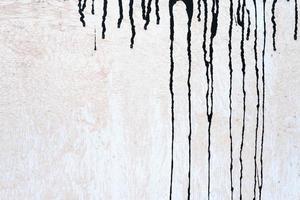 Stained Black Painting on Grunge Concrete Wall Texture Background. photo