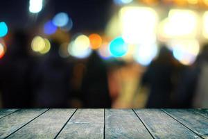 Wooden Table with Blurred of Bokeh in Restaurant Background. photo
