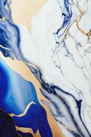 Elegant Blue, White, and Gold Marble Texture for high-end designs. Stunning image for website backgrounds, social media posts, and more. Bold, sleek patterns with luxurious color palette. photo